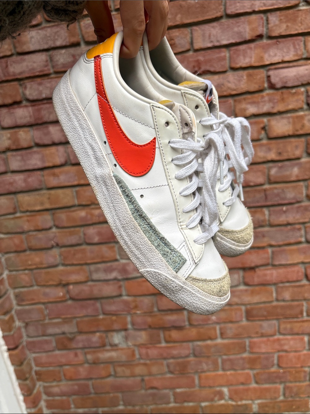 Nike White Sneakers with Red Swoosh and Yellow Heel